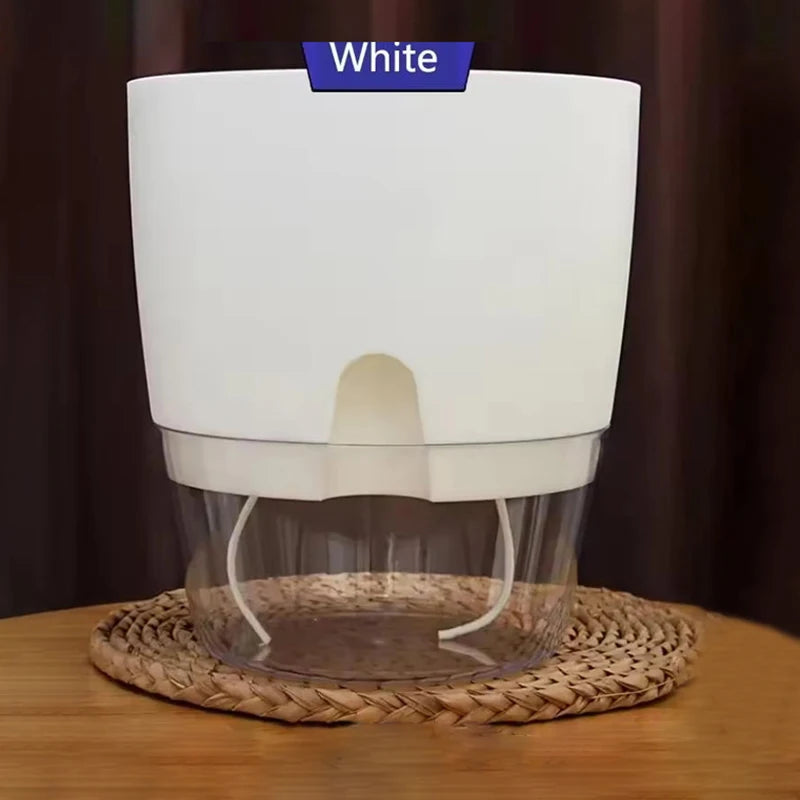 Self-watering plant pot with clear water reservoir